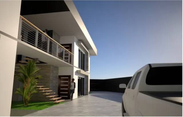 Exterior view of a two-story building featuring stone wall accents, a second-floor balcony with a metal railing, and an adjacent paved parking area with a white pickup truck.