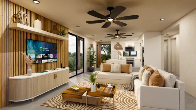 Open living room featuring a white sectional sofa, slatted wood feature wall with a television, and a kitchen visible in the background.