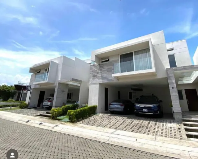 A contemporary residence located in Guachipilín Norte condominium is now available for sale